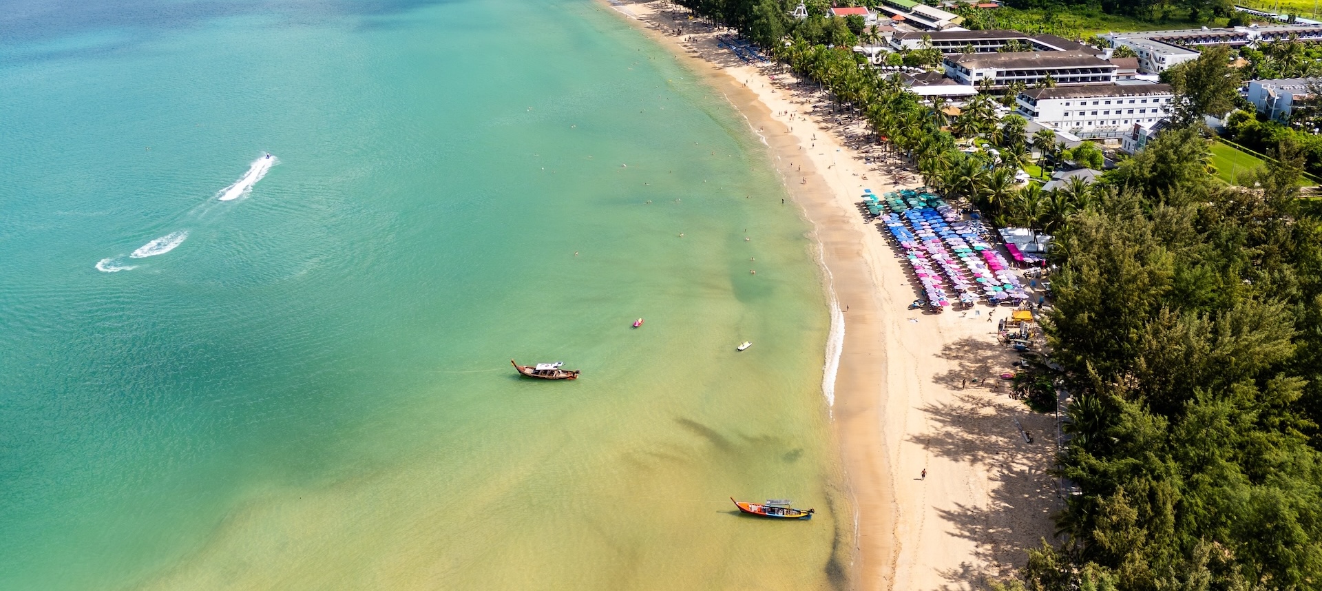 Aerial view of Kamala Beach, home to plenty of places to visit in Phuket with family.